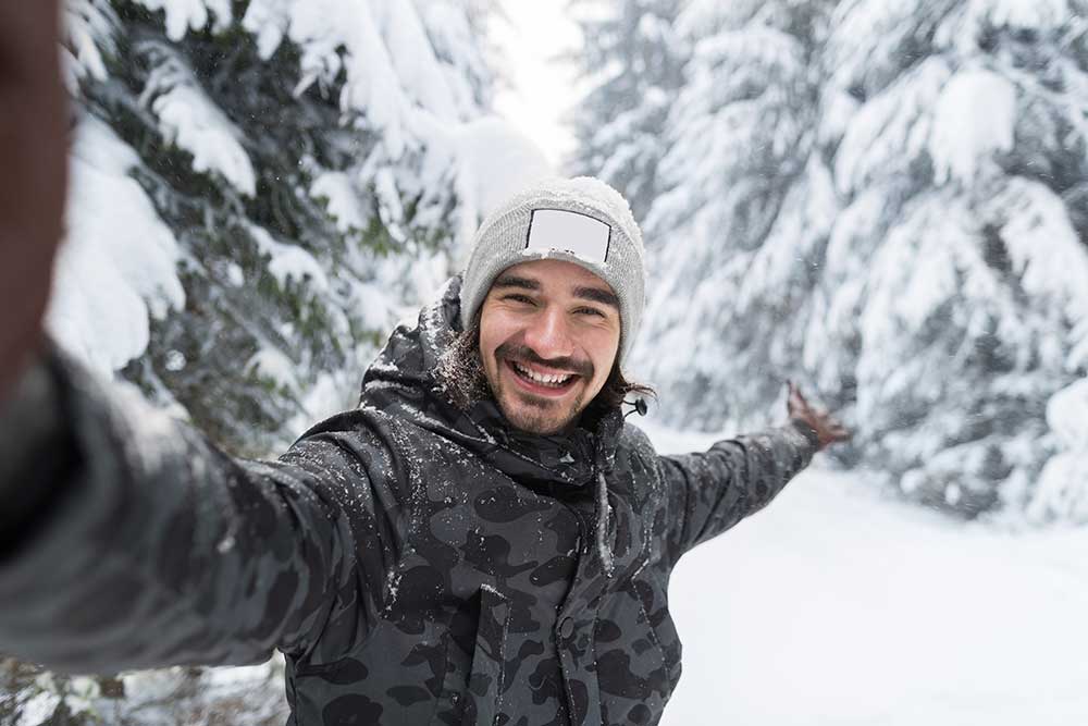 young-man-smile-camera-taking-selfie-photo-in-wint-small.jpg